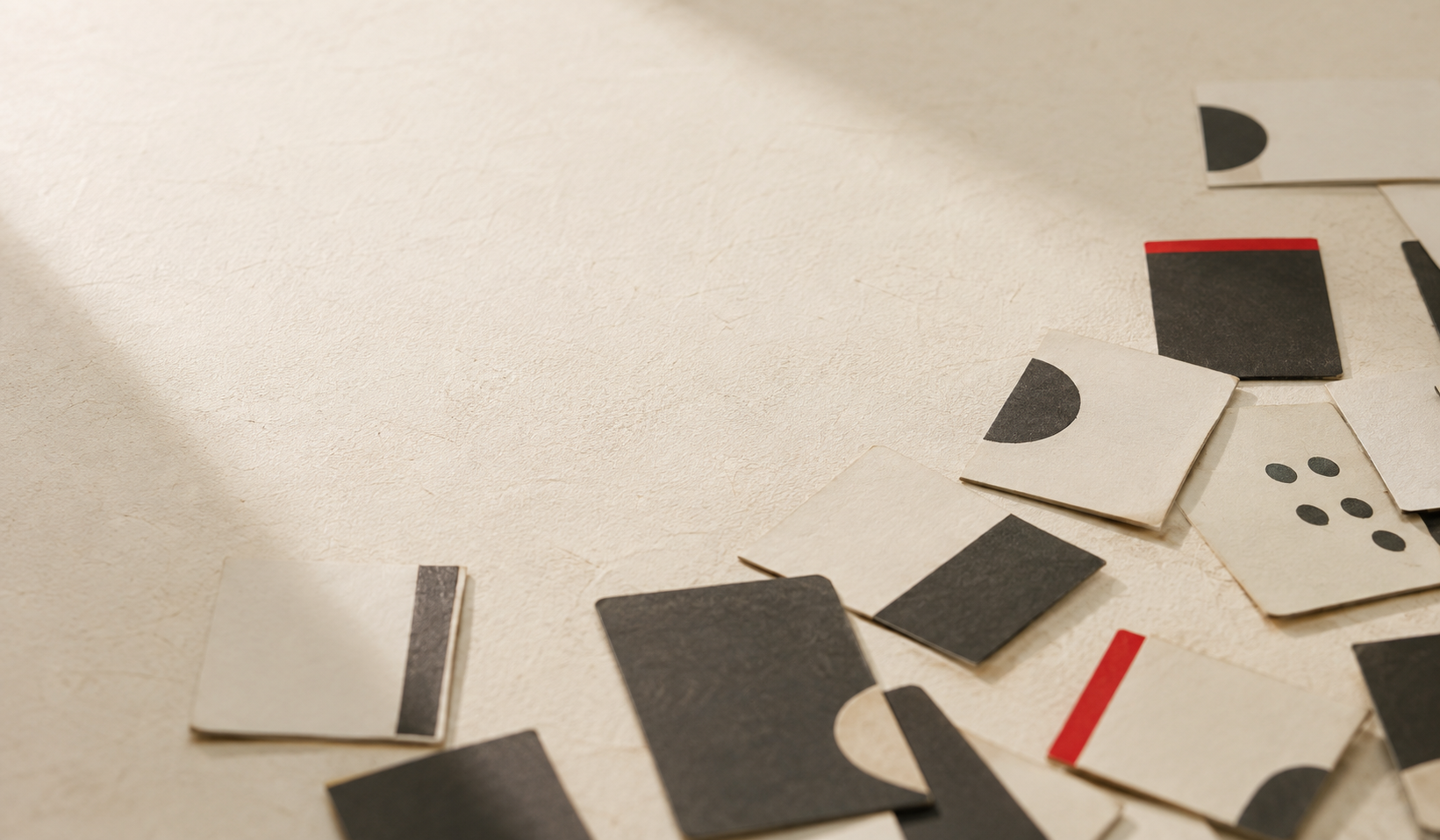Karuta playing cards scattered on a sheet of handmade paper